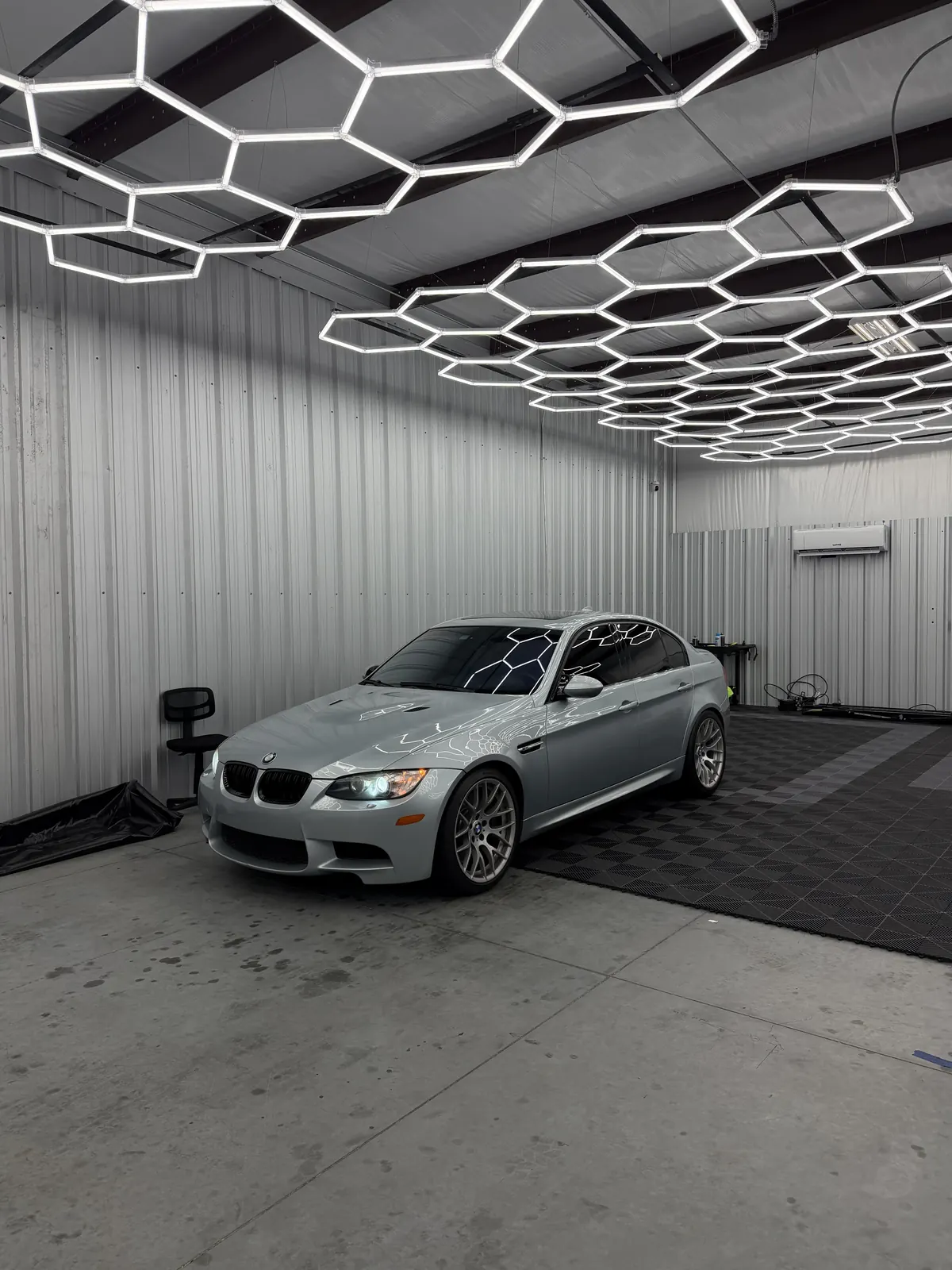 Cloak's showroom in Tomball under the hexagon ceiling lights.