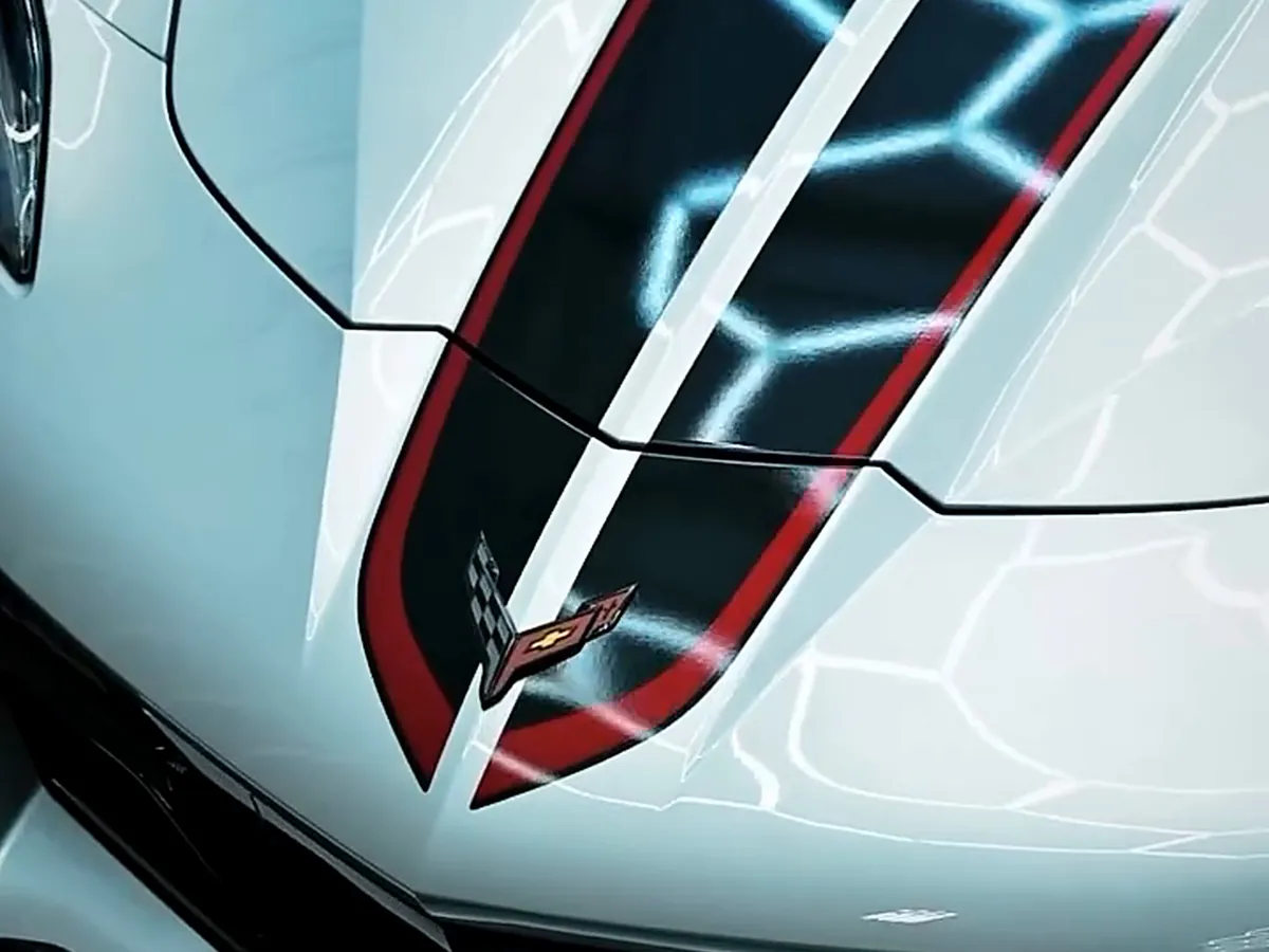 The finished Z06 hood, the hexagon lights reflected sharp in the paint.