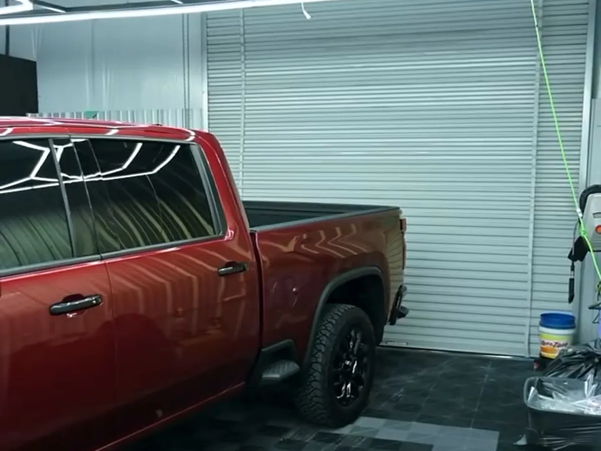The same Silverado in the showroom after ceramic tint, every window dark.